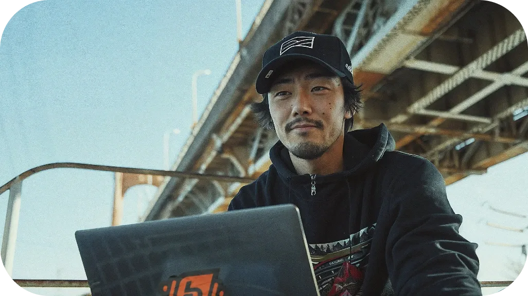 A Chinese Professional Using Laptop Hero Mobile