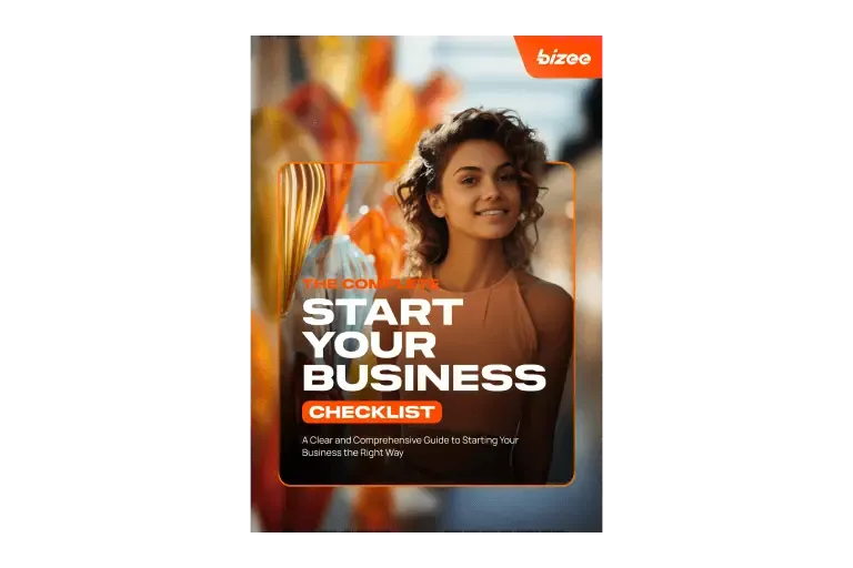 Cover of the Start Your Business checklist guide with a smiling woman