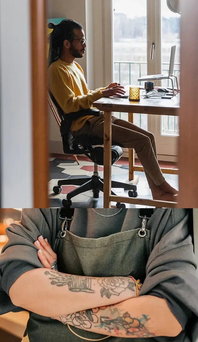 Business owner working at a desk beside a window
