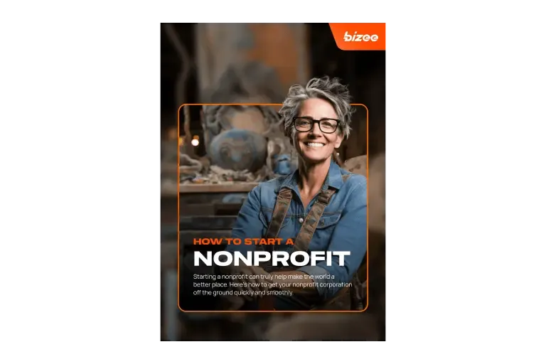 Guide cover titled How to start a nonprofit, showing a smiling woman in a denim shirt in a workshop