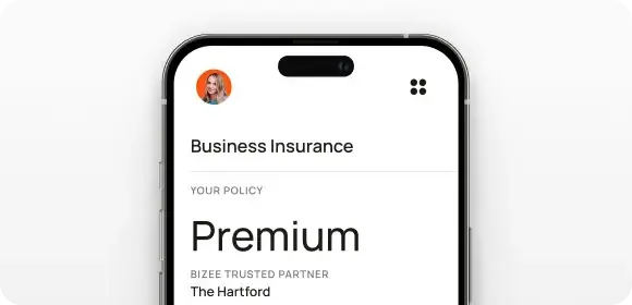 Phone screen from the Bizee app showing a Premium business insurance policy