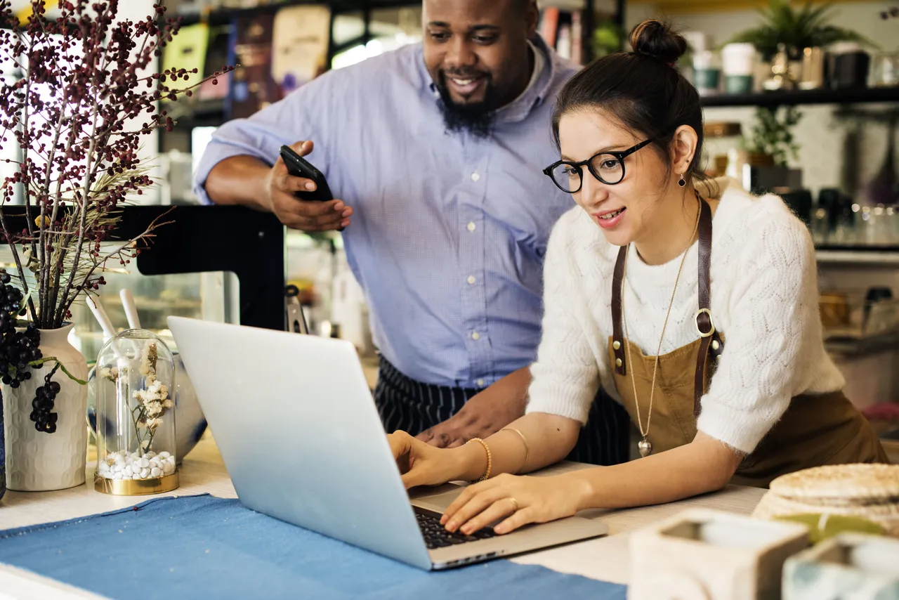 Small Business Owners Working On Laptop