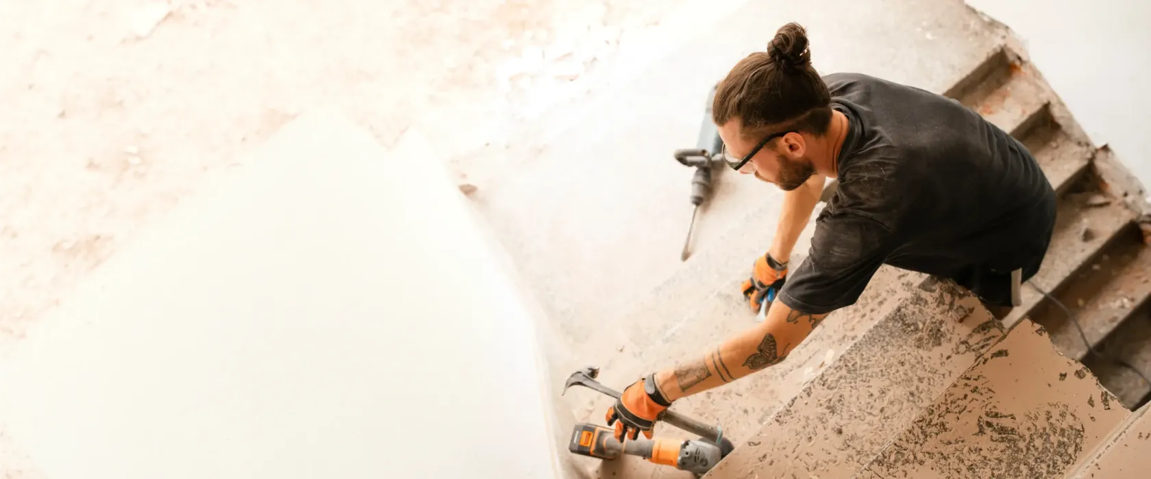 Business owner using a drill in a workshop