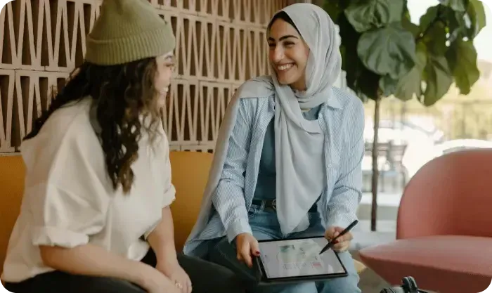 Two Women Talking Tablet Hijab Beanie