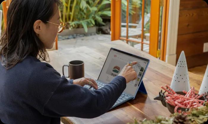 Asian woman working from home on a laptop