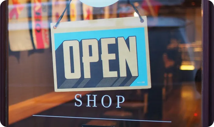 A store sign with "Shop open" written on it.