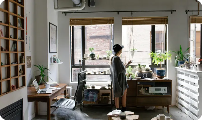 A woman working from home in her tidy studio