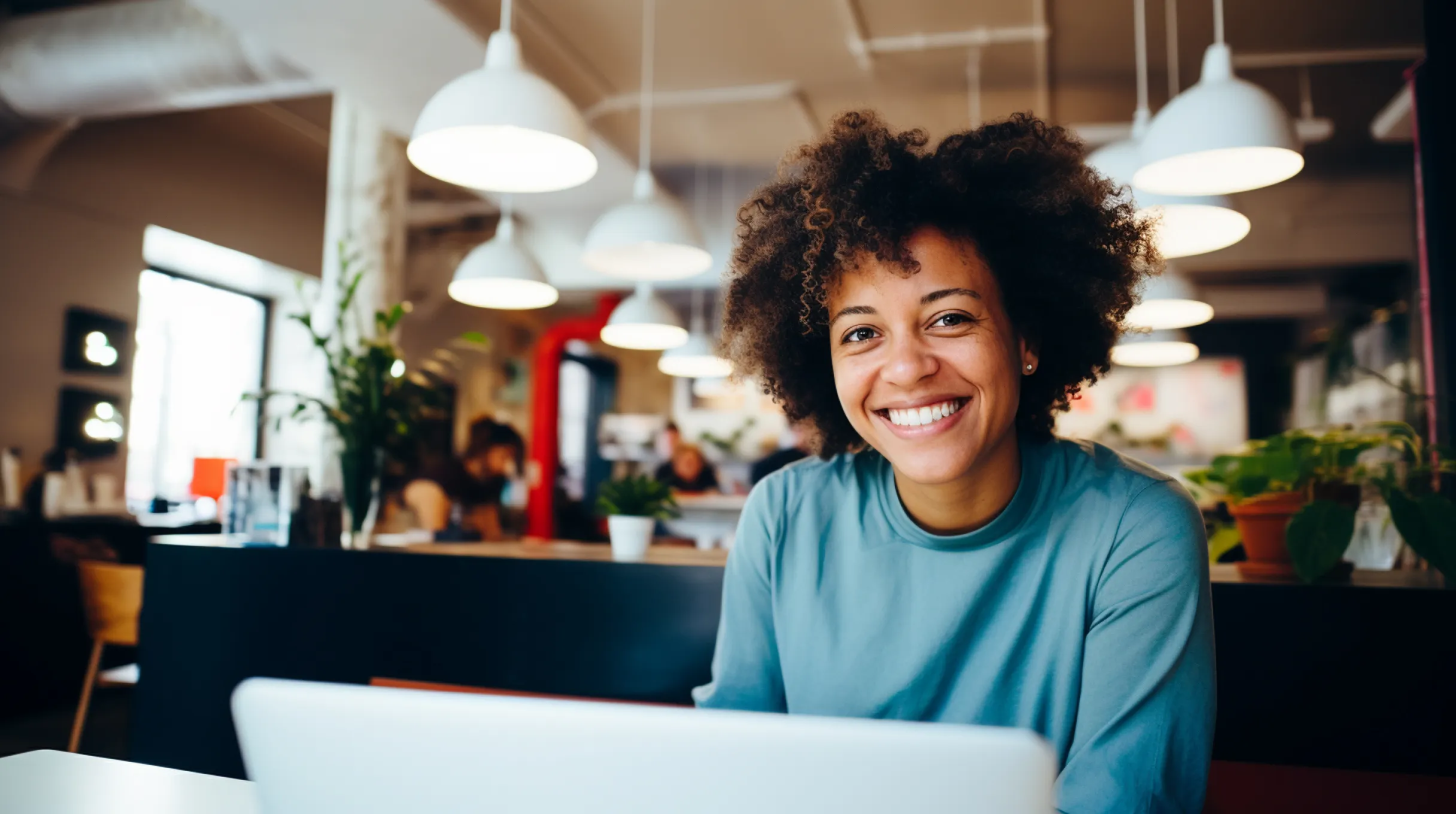 A black woman sitting in a restaurant