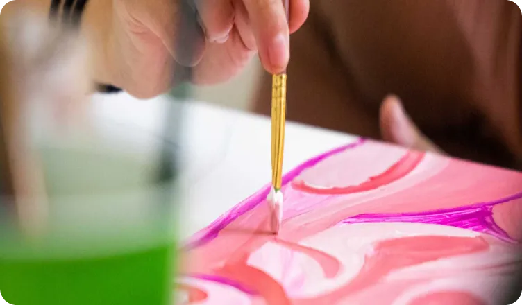 Isabel Cervantes, founder of Isa Paints, at work