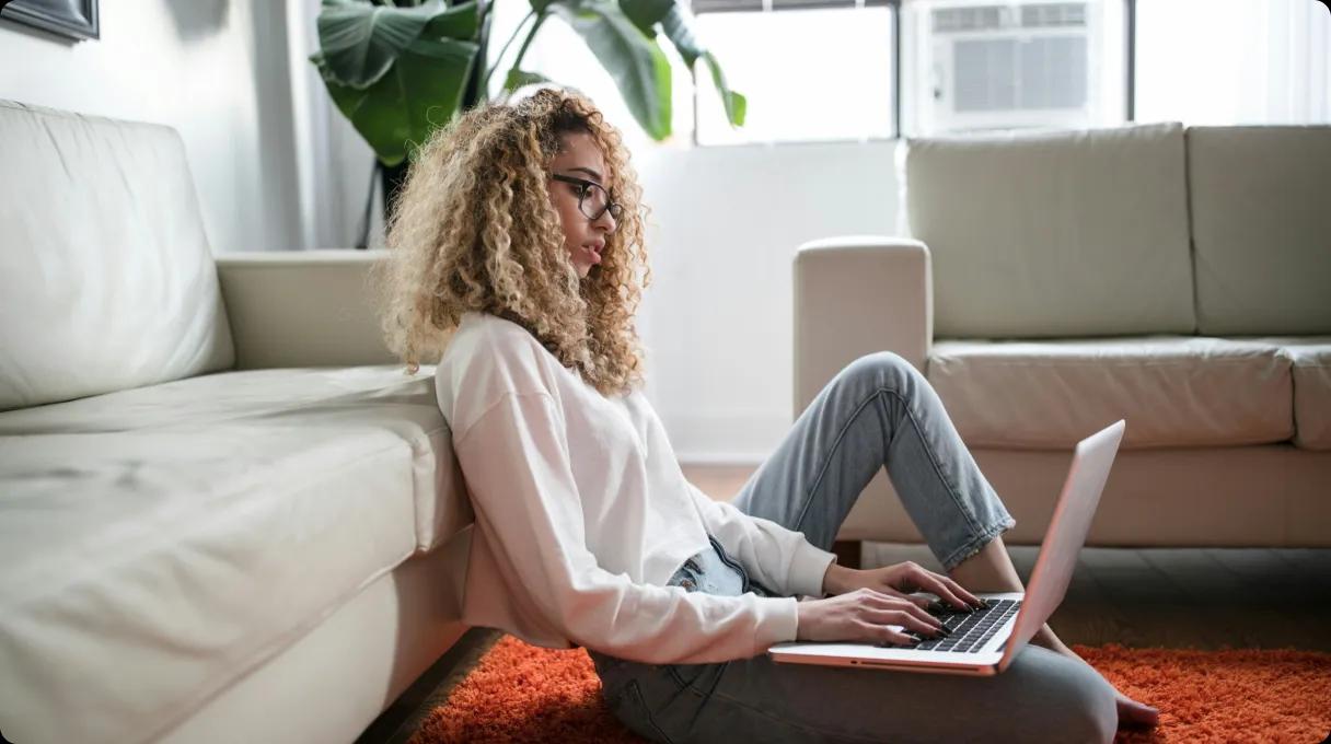 A woman working from home on a laptop