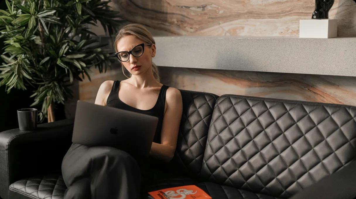 A woman working on a laptop is style.