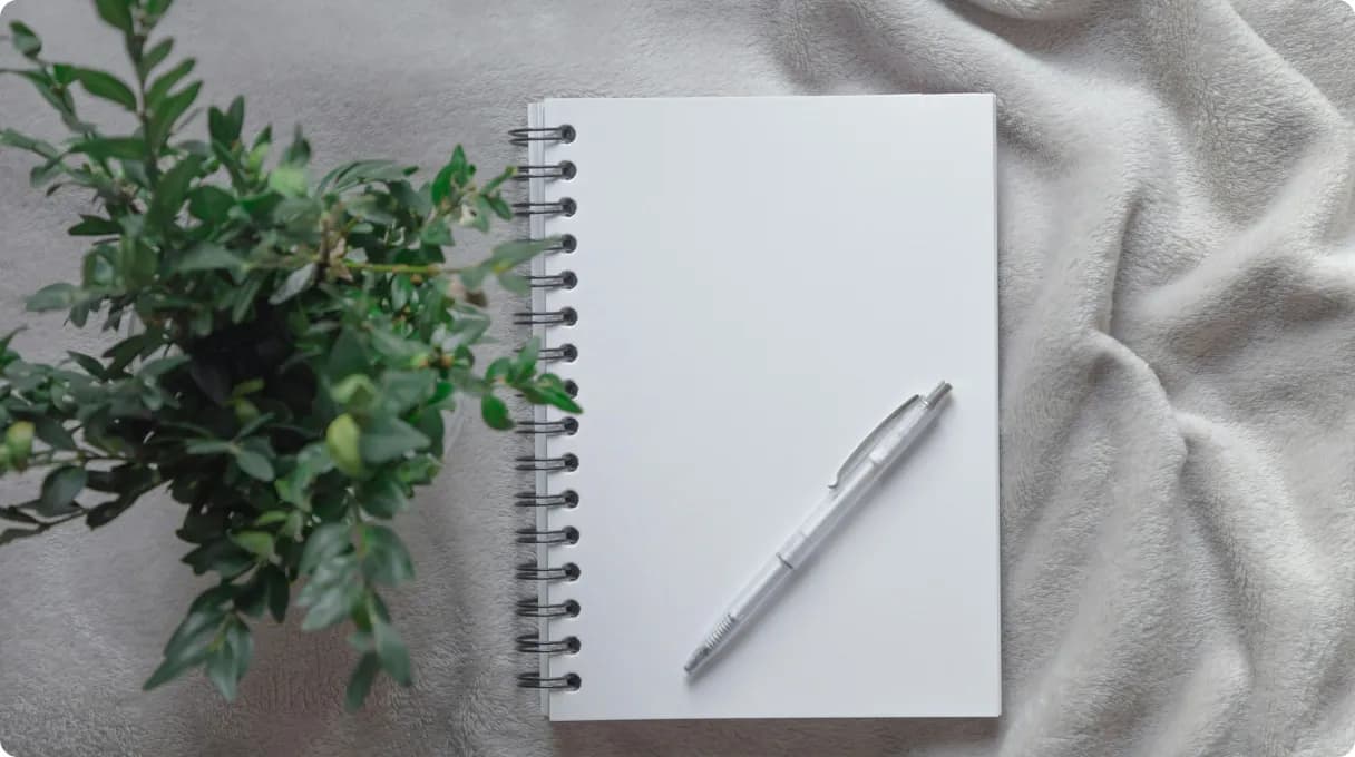 a-person-is-writing-on-a-piece-of-paper