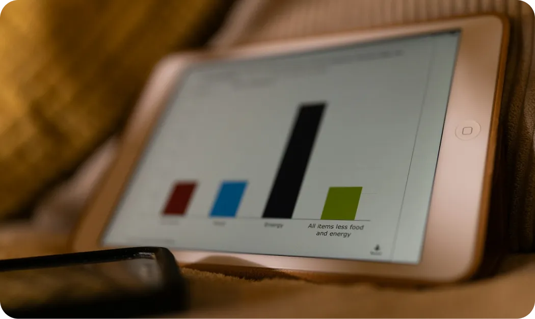 a-tablet-computer-sitting-on-top-of-a-bed