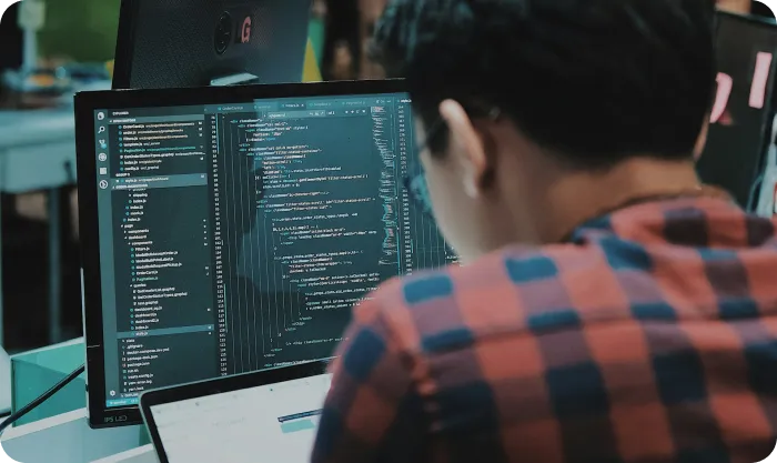 Sitting man using gadget in room
