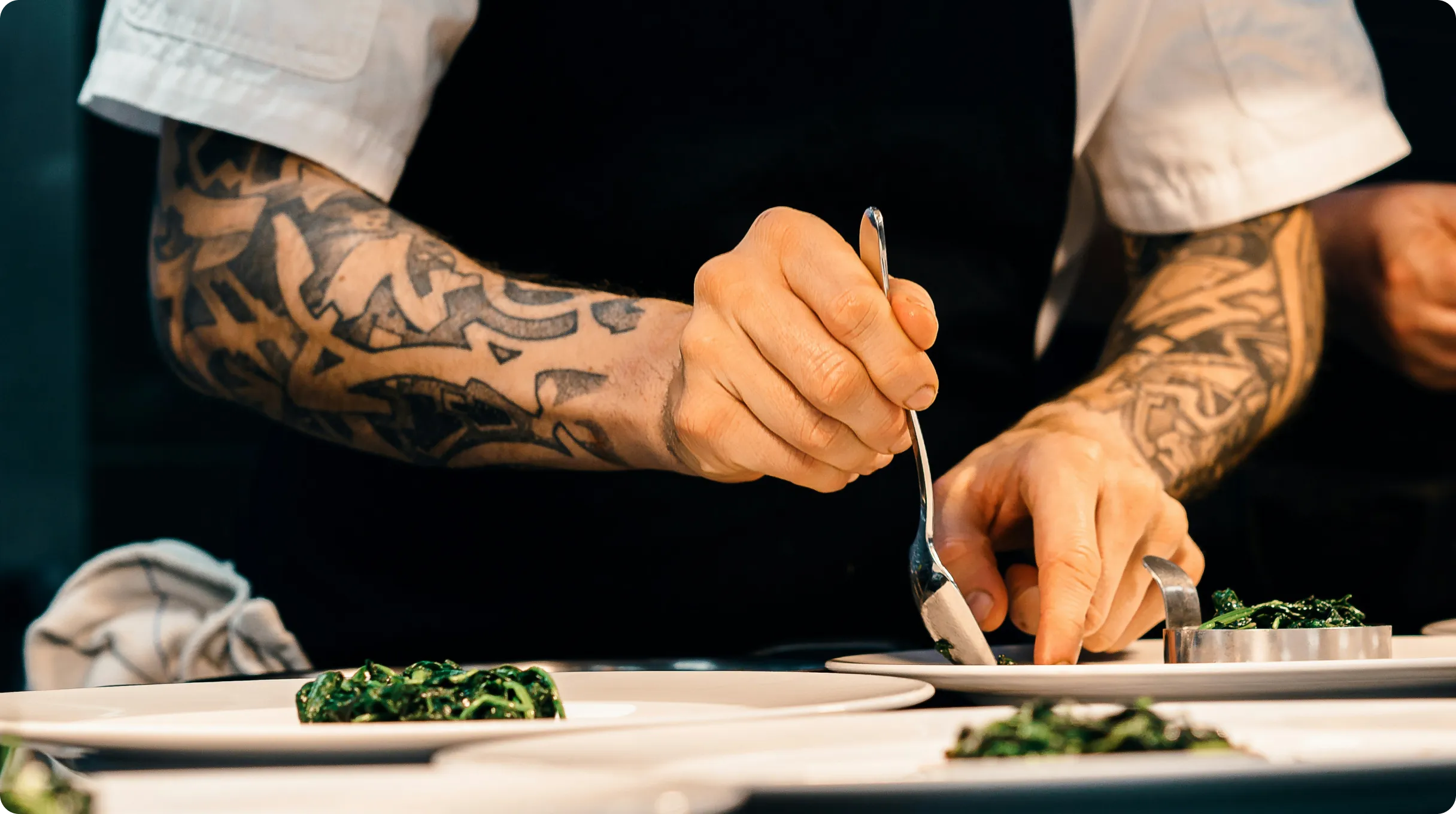 three-men-sitting-on-chair-beside-tables