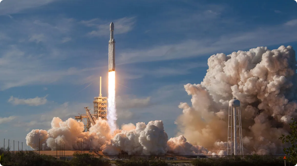 three-men-sitting-on-chair-beside-tables