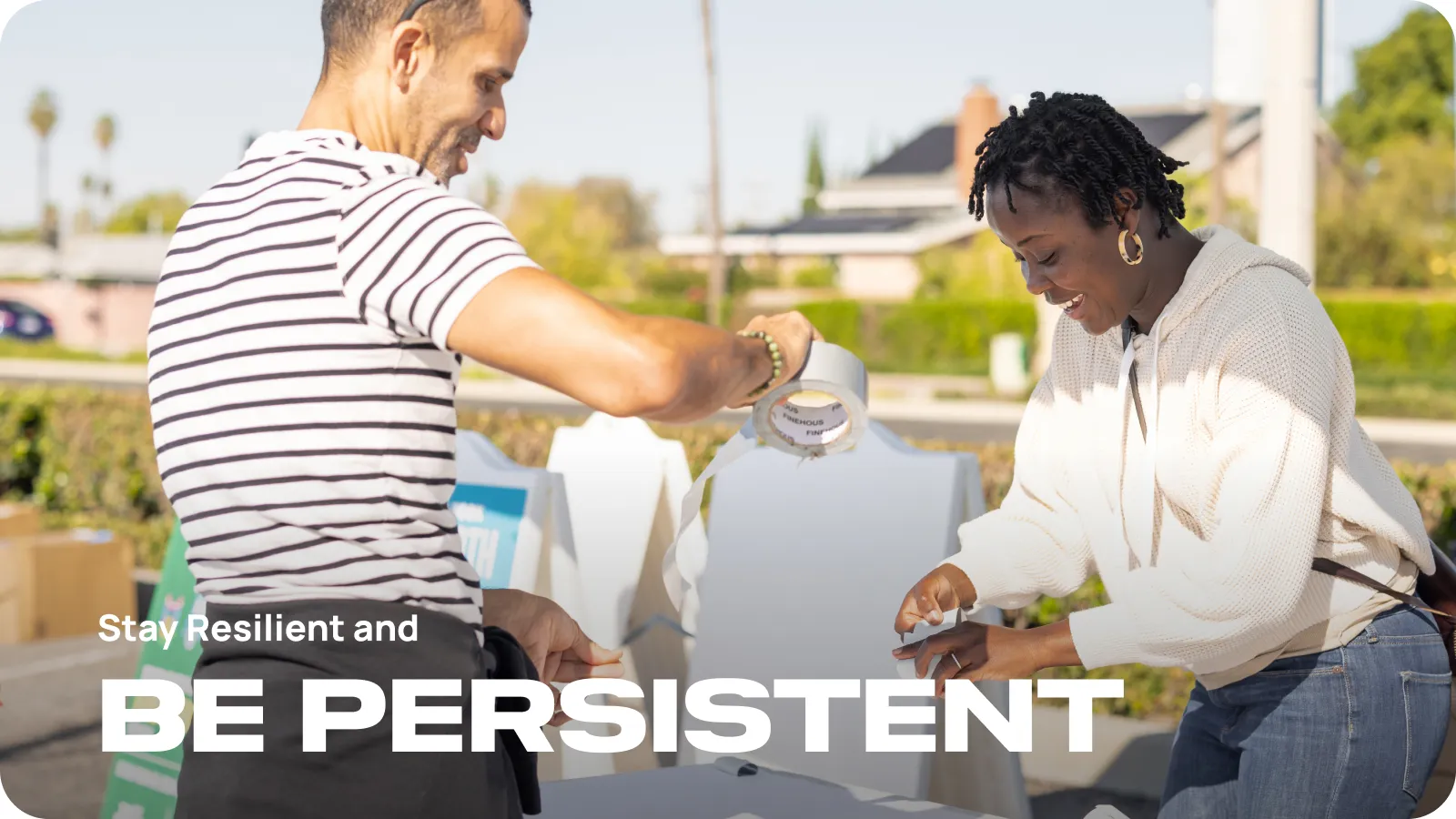 People working at the stand of Spicy Green Book. Title: Stay resilient.