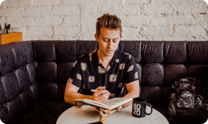 A Man Working From A Cafe