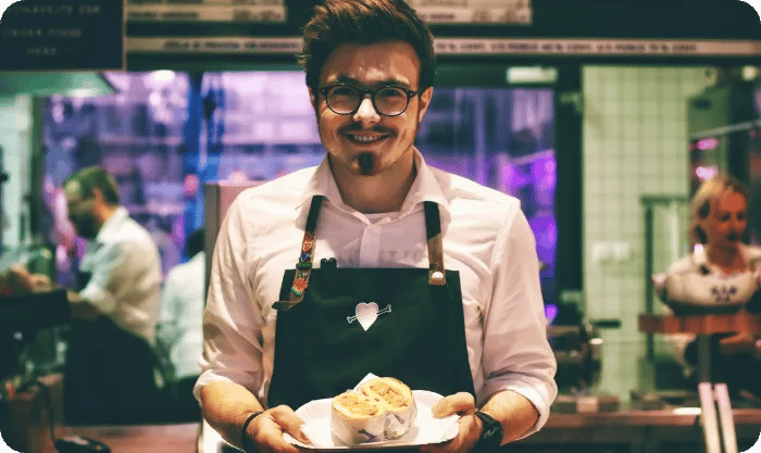 Chef Holding Fish Dish