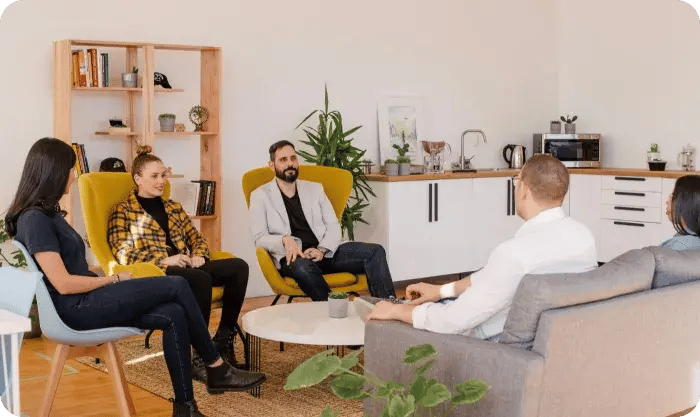 Group Meeting Discussion In Modern Office Lounge