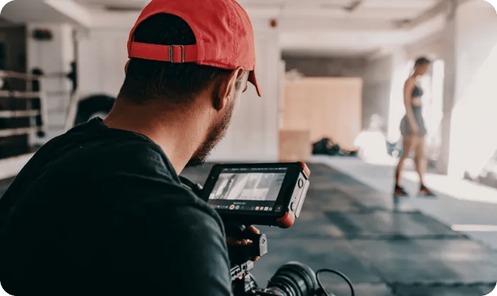 Man Taking Photo Of Woman At The Gym