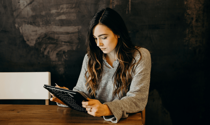 Stressed small business owner surrounded by warning signs like ‘Unpaid Taxes,’ ‘Trademark Dispute,’ and ‘No Privacy Policy,’ highlighting common legal pitfalls such as misclassification, missing licenses, and privacy compliance.