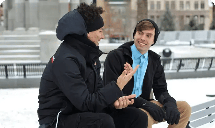 Two Men Talking Outdoors Winter Bench