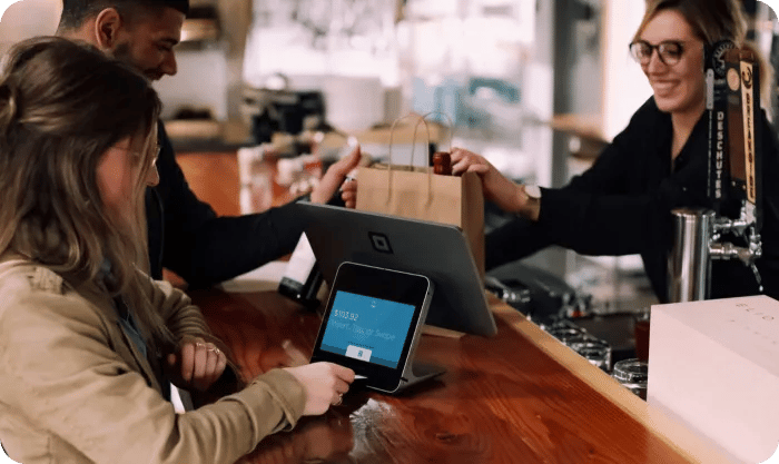 Woman Is Paying For An Order With A Credit Card