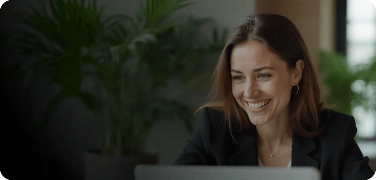 Professional Woman Smiling During Video Call Remote Work Environment Desktop
