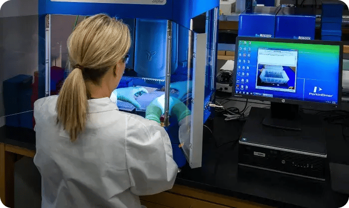Scientist Working With Automated Lab Equipment