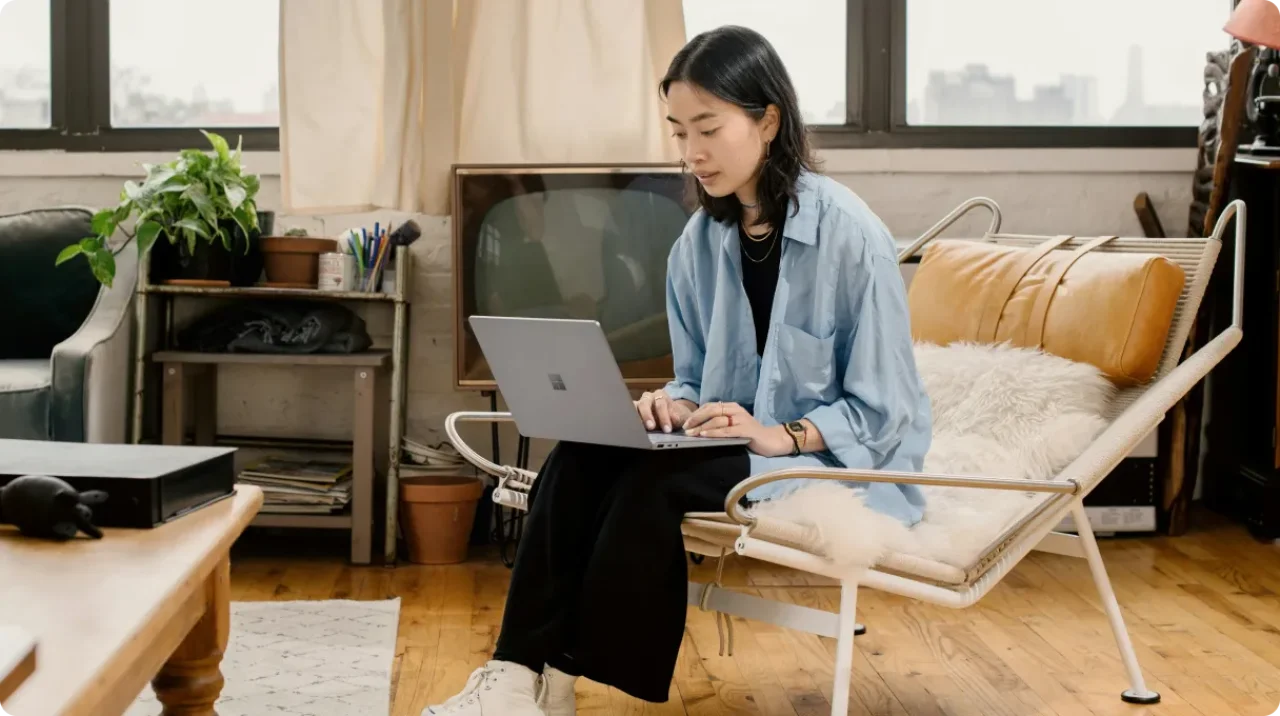 A Woman Working Remotely On A Laptop