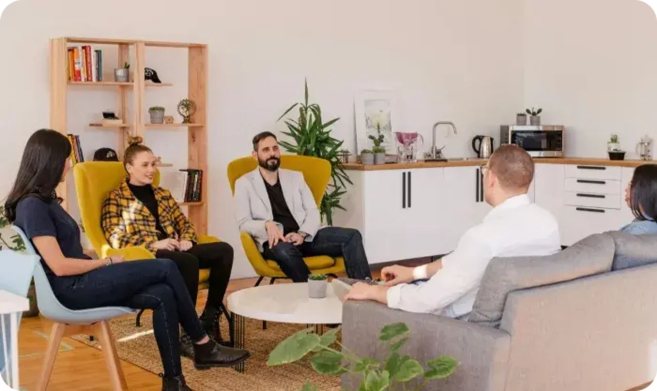 Group Meeting Discussion In Modern Office Lounge