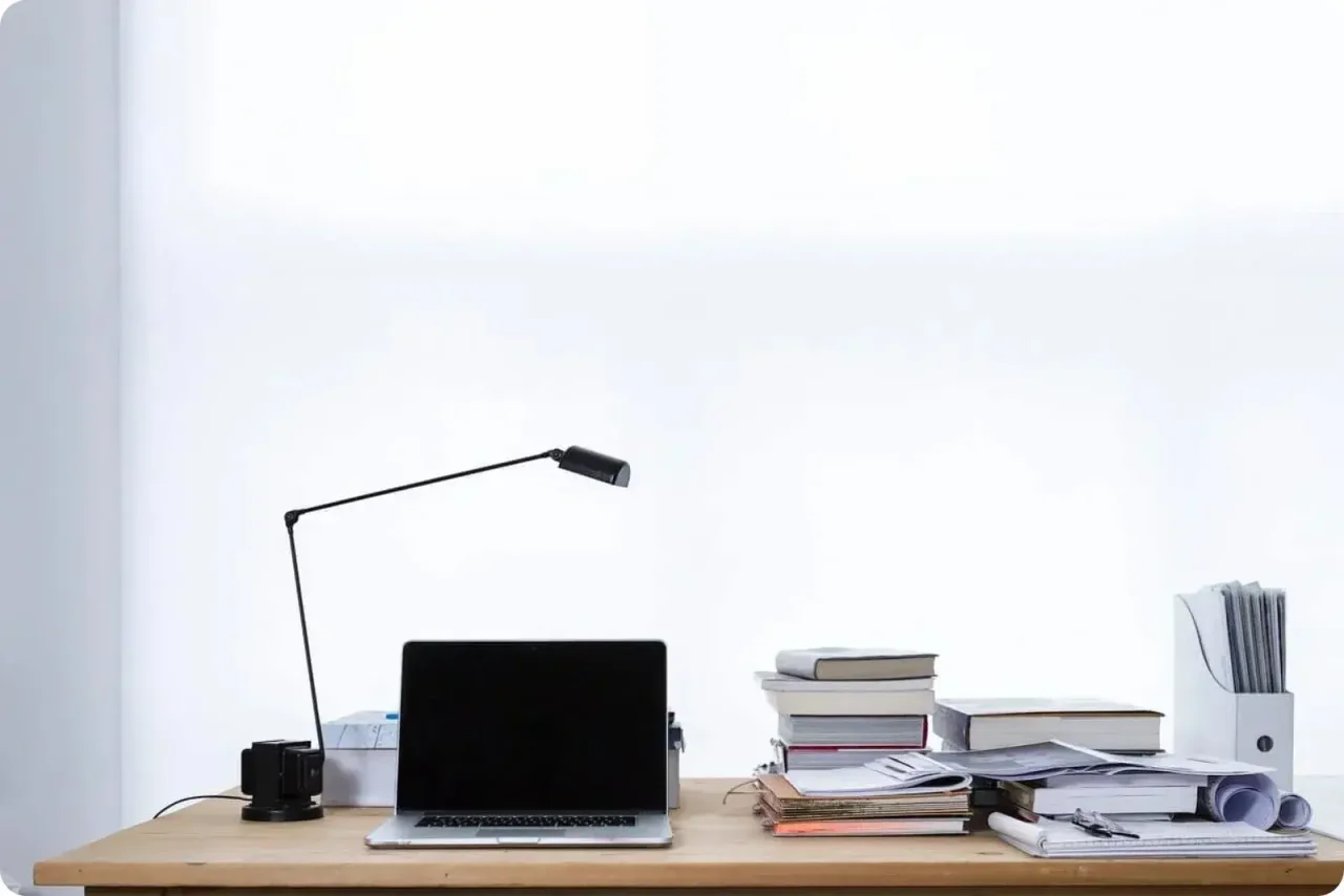Minimalist Workspace With Laptop And Books
