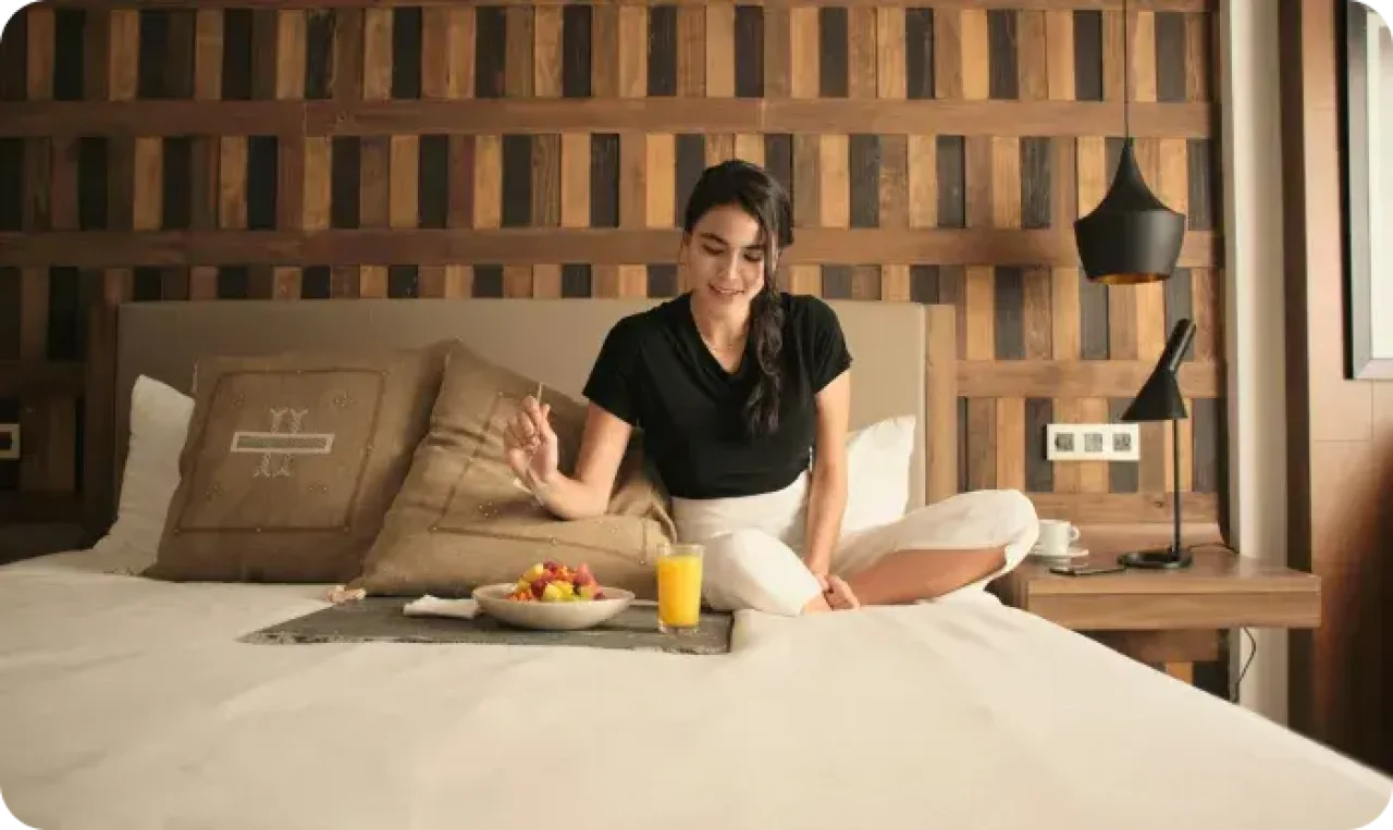 Woman Enjoying Breakfast In Cozy Hotel Room 1767032167