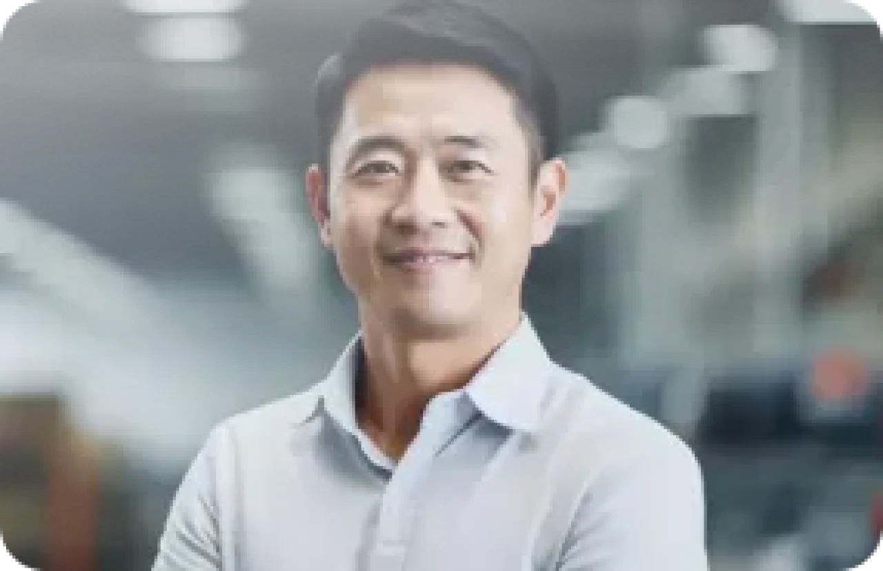 Smiling Industrial Professional In Modern Factory Environment
