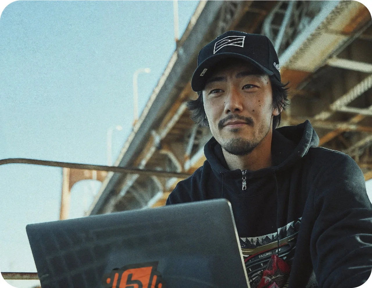 A Chinese Professional Using Laptop Hero