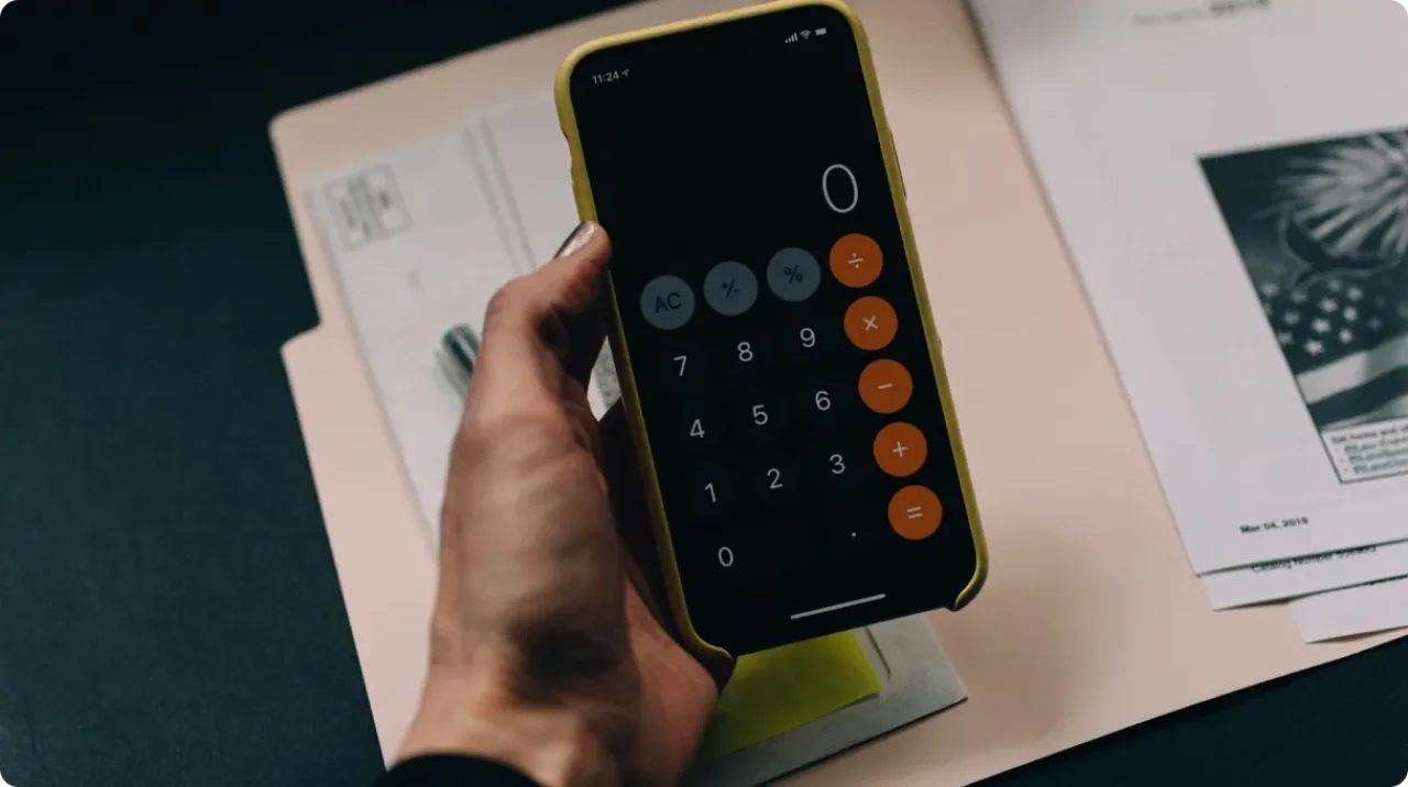 Calculator On Phone Against Documents