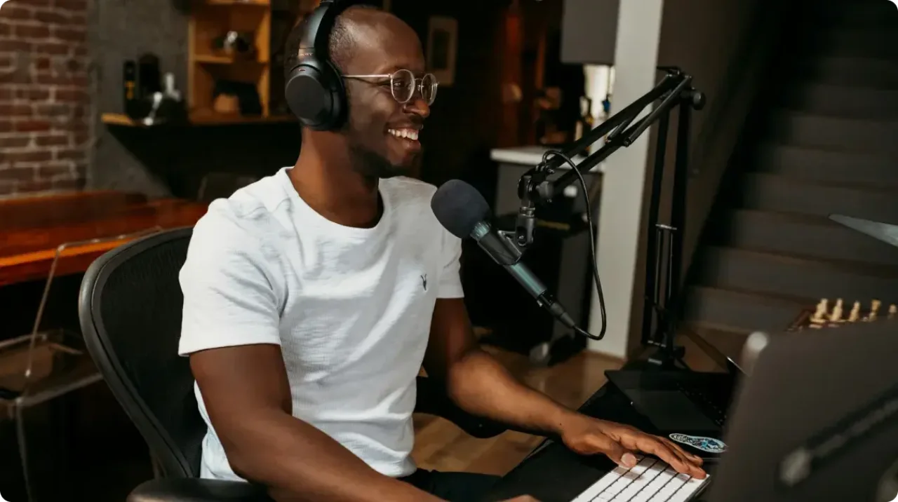 Man Recording Podcast With Microphone And Headphones