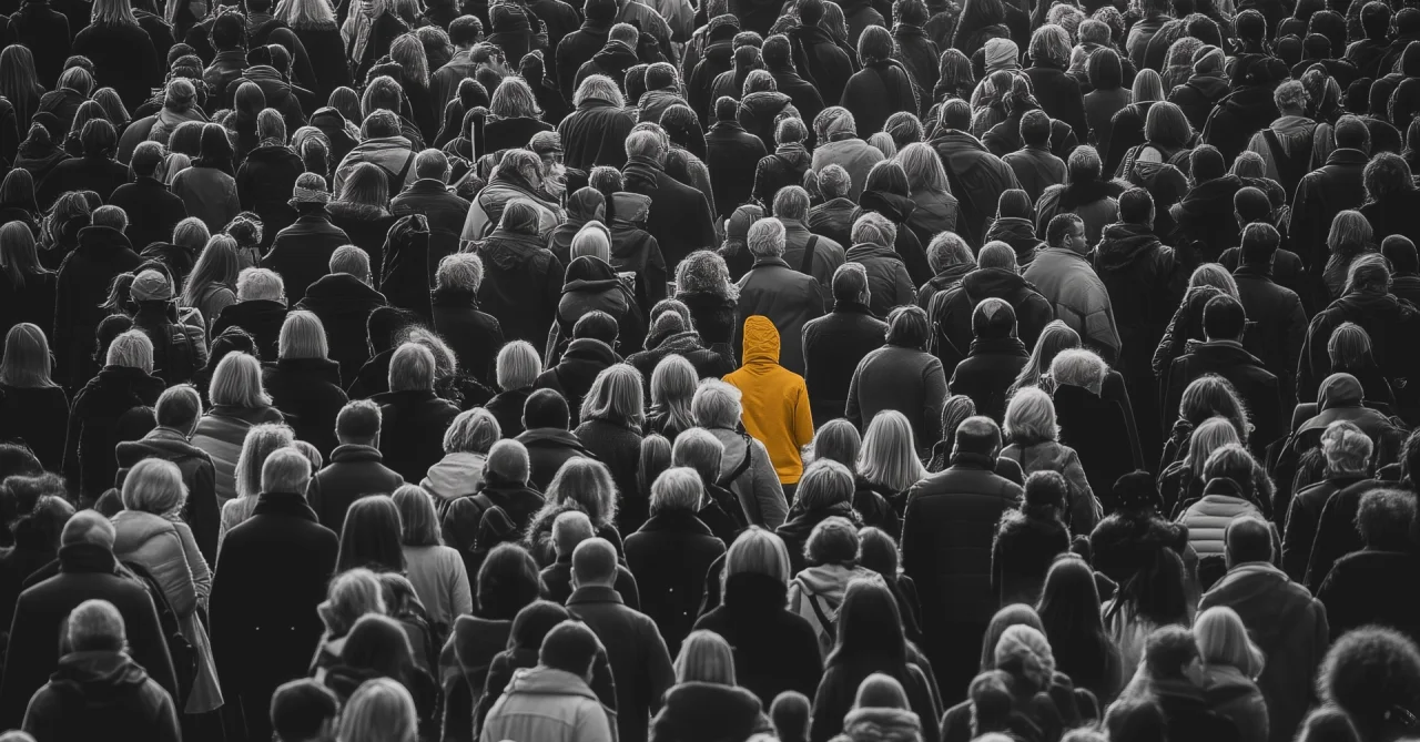 Person Standing Out In Crowd