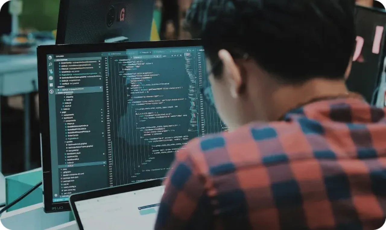Sitting Man Using Gadget In Room